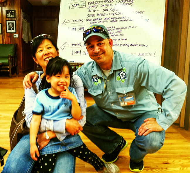 Janet, Quinn and Al Q with a family portrait by Roy Fukushima