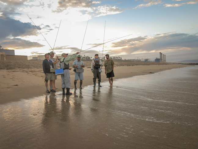 Jim Solomon explaining the lay of the land prior to demonstrationing how to catch a surf perch. photo by Al Q