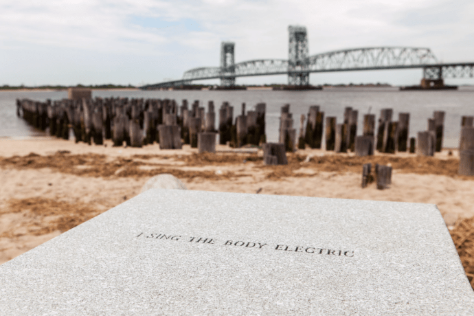 Blocks of granite lay along Gateway National Recreational Area in Fort Tilden inscribed with Walt Whitman's poetry. This is a permanent art piece by Patti Smith.