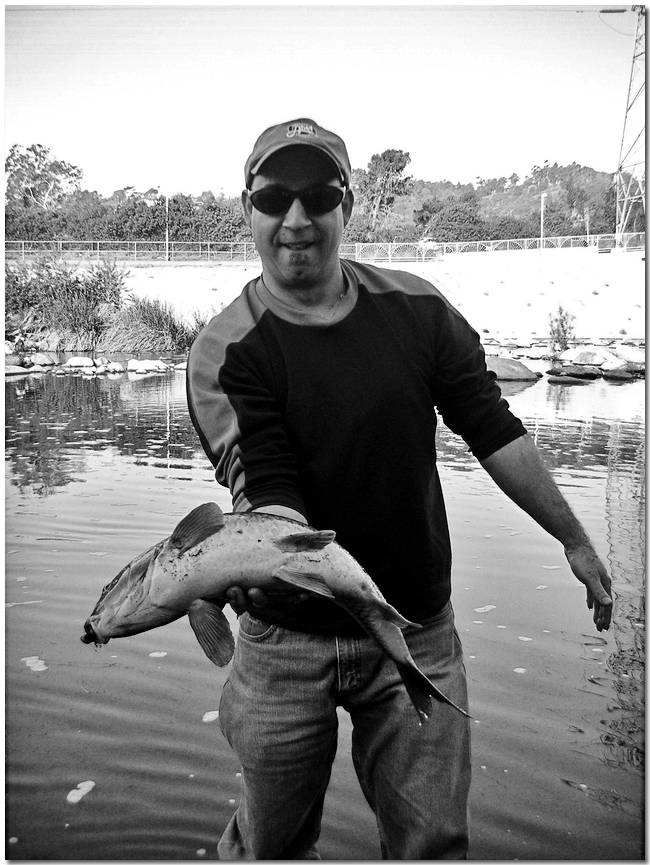 Al Q  back in 2007 with a concrete carp. Photo by James Dwyer.
