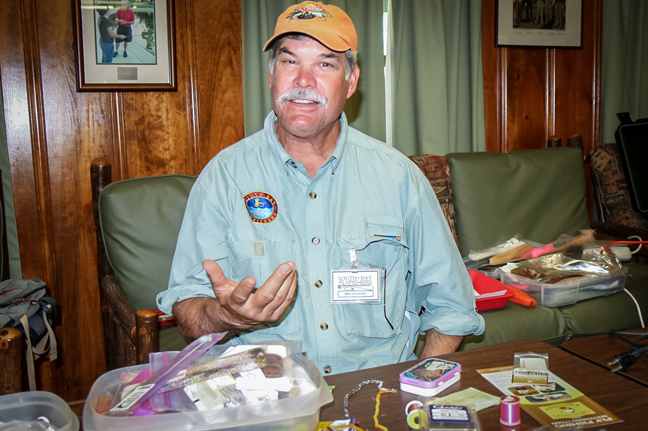 Mike Centofani working the fly tying table. photo by Michael Schweit