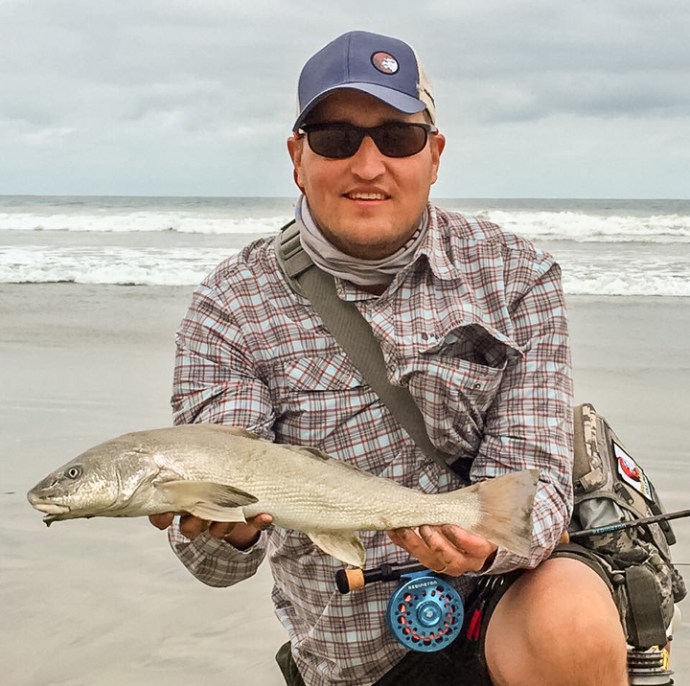Matt Brown with a fine corbina on the fly. Photo courtesy of Matthew brown