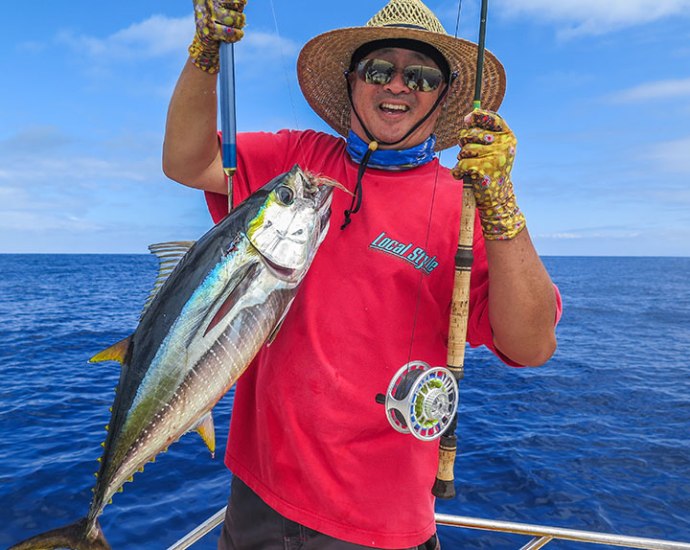 Ken gets his first Ahi on fly. Landed on an eight weight, quite a battle. Photo by Al Quattrocchi