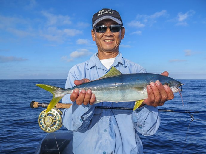 Roy with a nice firecracker yellowtail. Photo by Al Quattrocchi