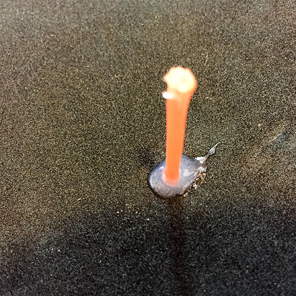 Add glue to bottom of basket prior to pulling the trimmer line all the way through from the basket side and let set. Photo by Al Q