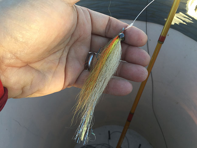Natural bucktail closer with flash tails in different colors, don't leave home without em. Photo by Al Q
